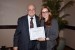 Dr. Nagib Callaos, General Chair, giving Ms. Maria Henkel the best paper award certificate of the session "Education and Information Systems, Technologies and Applications II." The title of the awarded paper is "Educators of the Information Society: Information Literacy Instruction in Canadian Informational Cities."